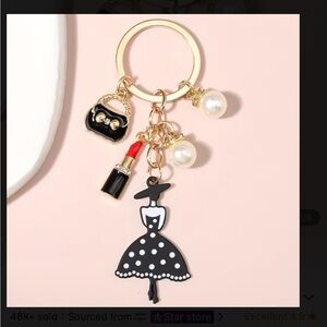 XSOLDX Chic Black and White Dress Keychain with Gold Accents - NEW